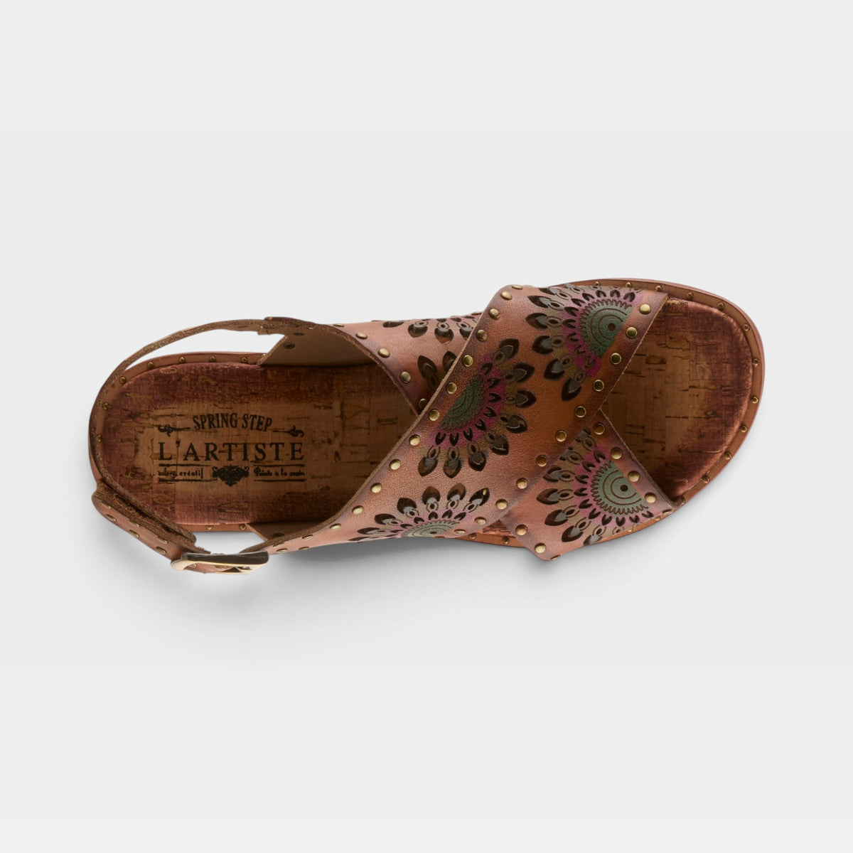 Top-down view of L'Artiste Crossroads sandal with laser-cut floral leather straps and gold studs