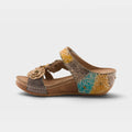 Women's wedge slide sandal with embossed floral leather upper and flower accent detail