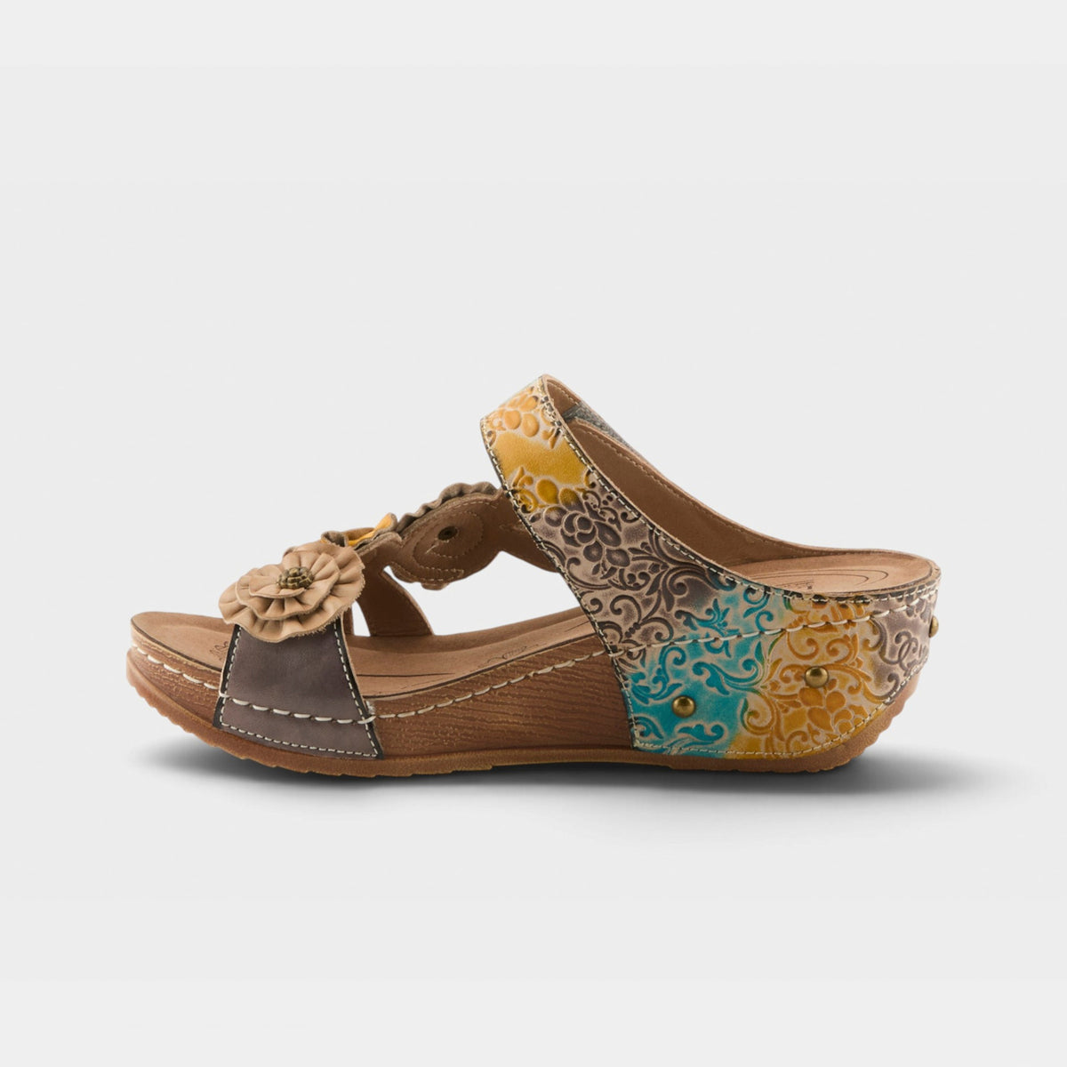 Women's wedge slide sandal with embossed floral leather upper and flower accent detail