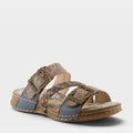 L'Artiste Astra slide sandal with ornate gold buckles and tooled leather straps on wedge sole