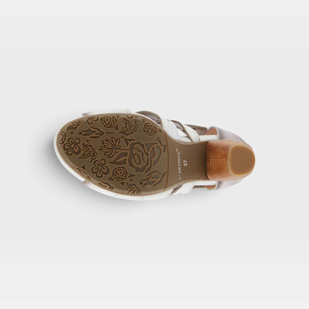 Bottom sole view of L'Artiste Icon sandal showing floral embossed outsole and stacked heel
