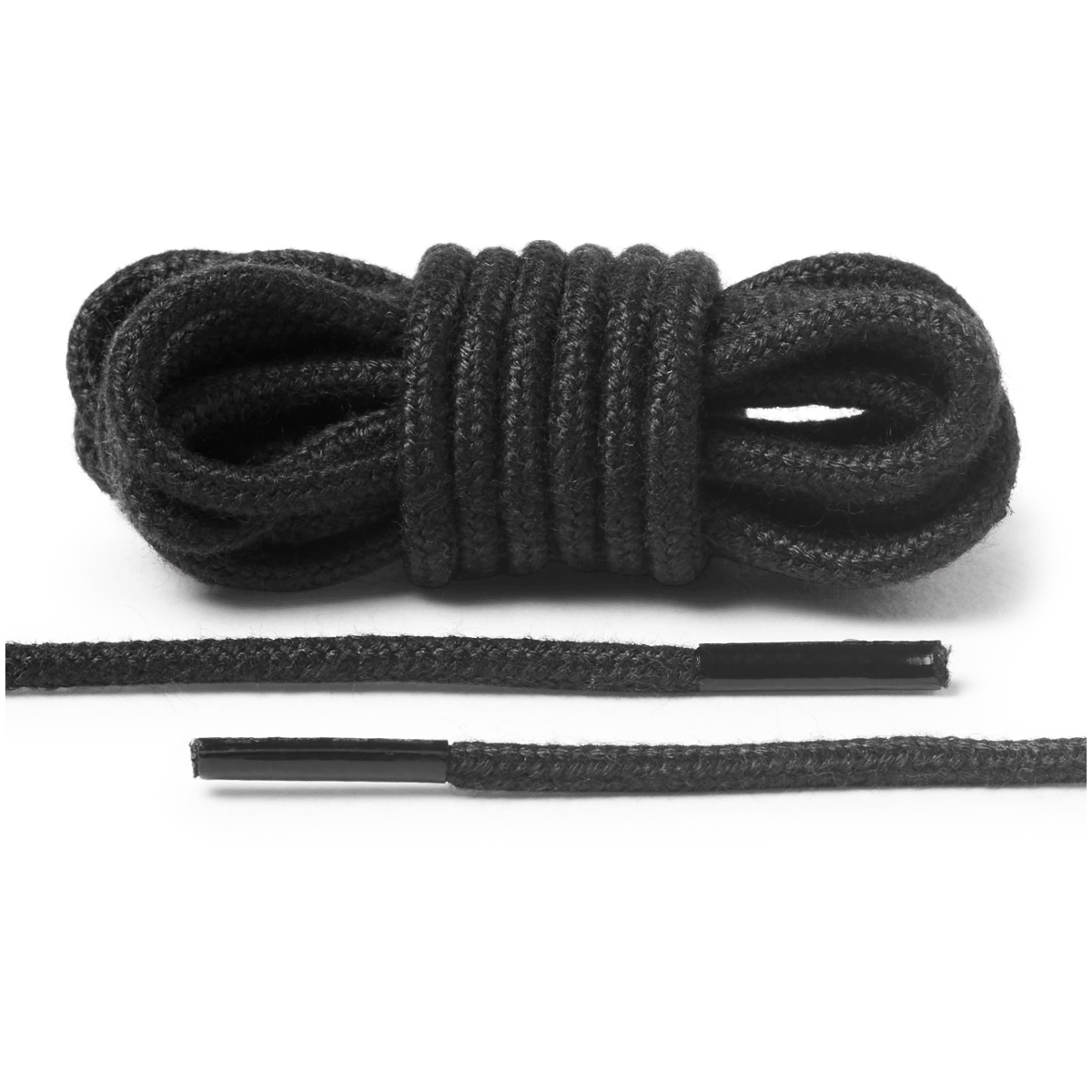 Coiled round shoelaces with aglet tips shown bundled and laid flat on seamless background