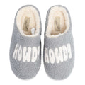Pair of gray sherpa slippers with white HOWDY lettering and cream fleece lining