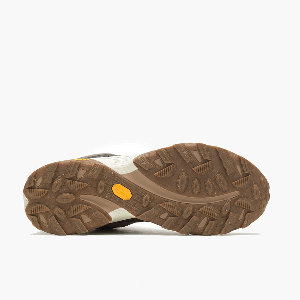 Bottom sole view of Merrell hiking shoe showing rugged brown lugged outsole tread pattern