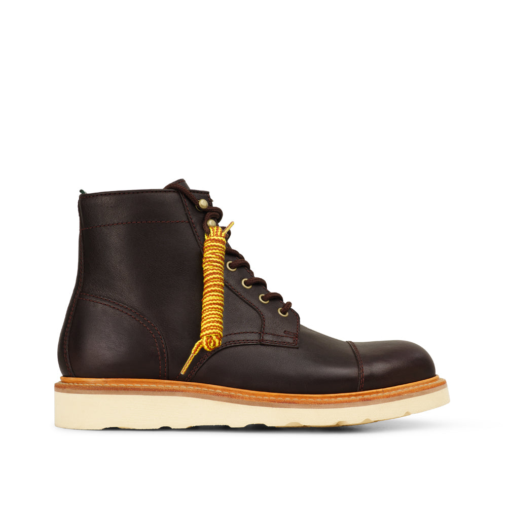 Milwaukee Borchert men's cap toe leather lace-up boot with cream wedge sole and gold laces