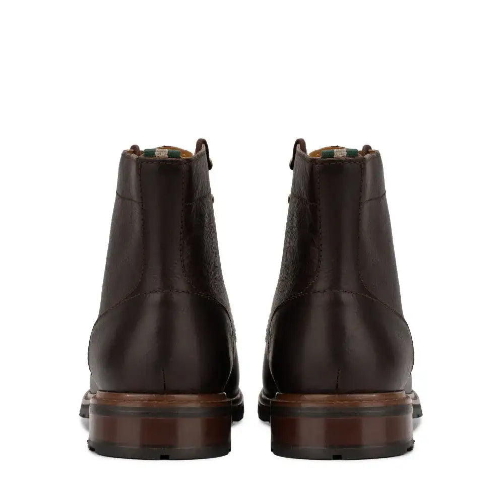 Rear view of men's plain toe leather ankle boots with pull tab and stacked heel