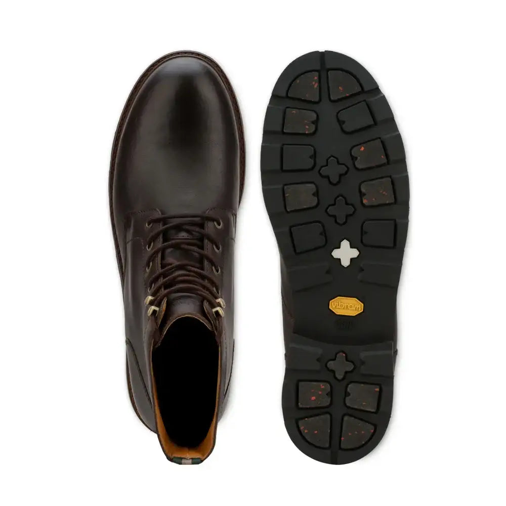 Top-down and sole views of a men's plain toe lace-up leather boot with Vibram outsole
