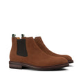 Men's suede Chelsea boots with elastic side panels and striped pull tab, angled view