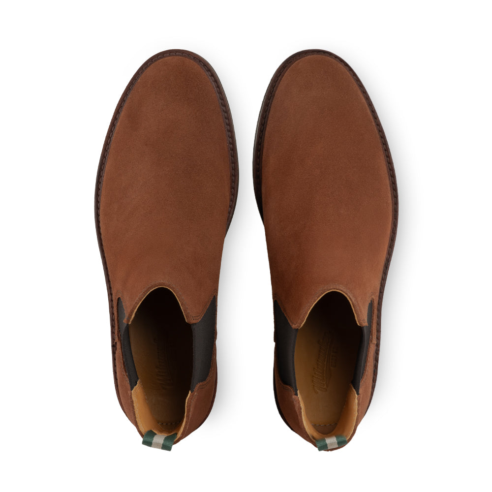 Top-down view of a pair of men's suede Chelsea boots with elastic side gussets