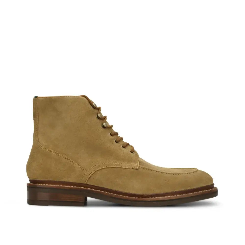 Men's lace-up moc toe ankle boot in suede with leather sole, side profile view