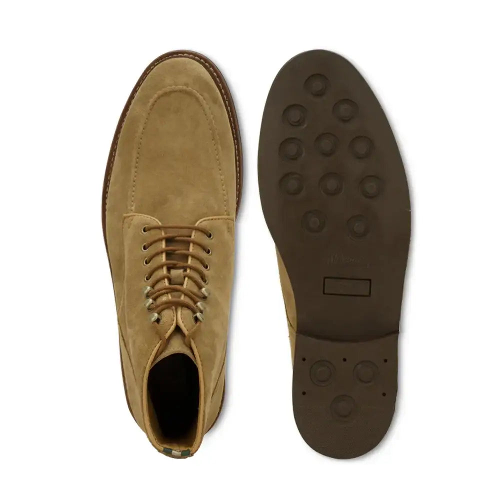 Top and sole view of a men's moc toe lace-up boot with textured rubber outsole