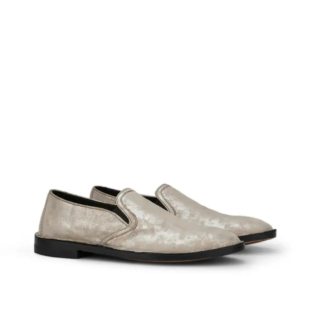 Women's slip-on loafers in distressed metallic finish with black sole, pair angled view