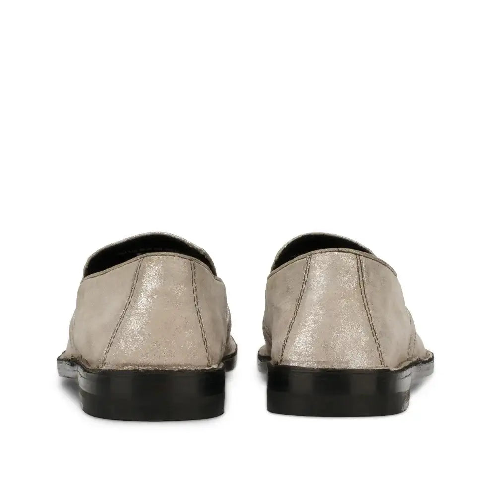 Back view of women's slip-on loafers with metallic shimmer finish and black sole