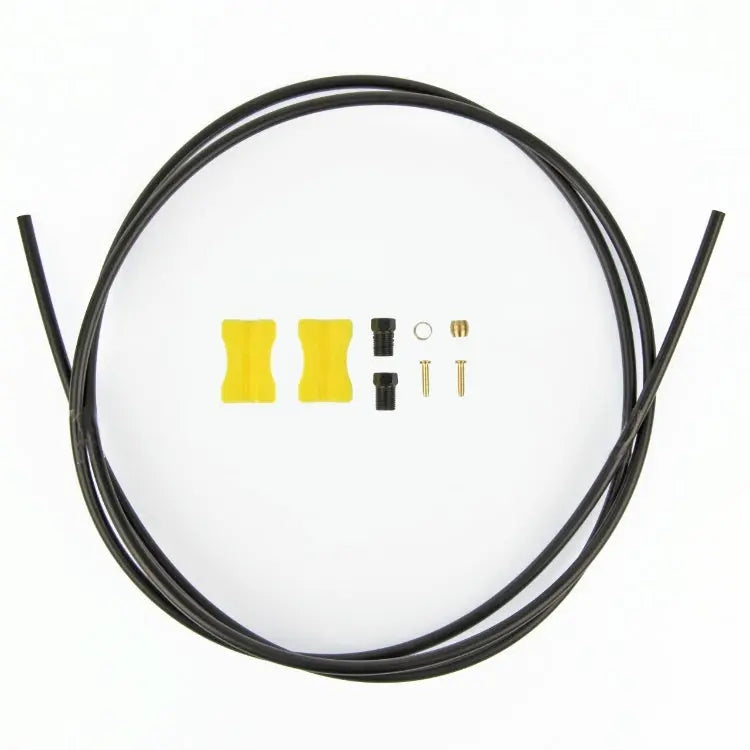 Coiled black hydraulic brake hose kit with yellow connectors and brass hardware components