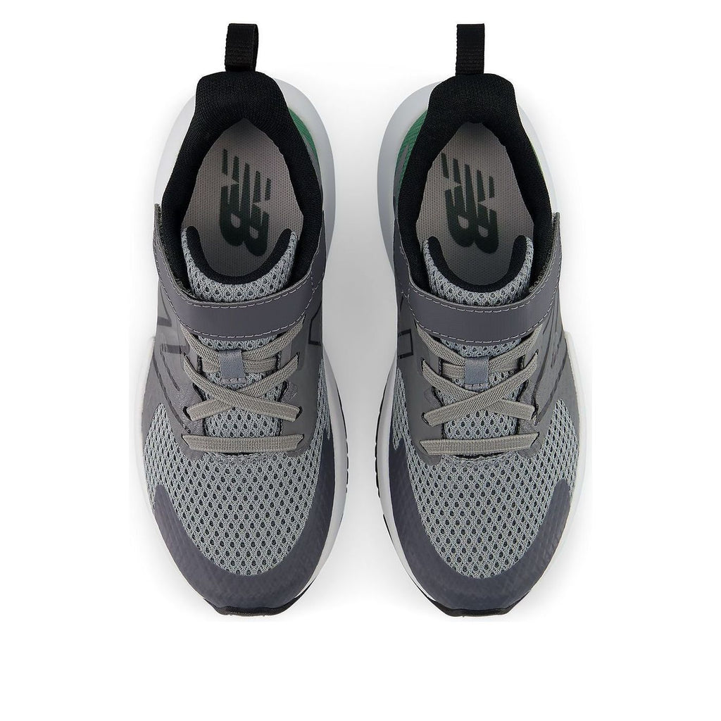 Top-down view of New Balance boys running shoes with bungee lace and strap closure