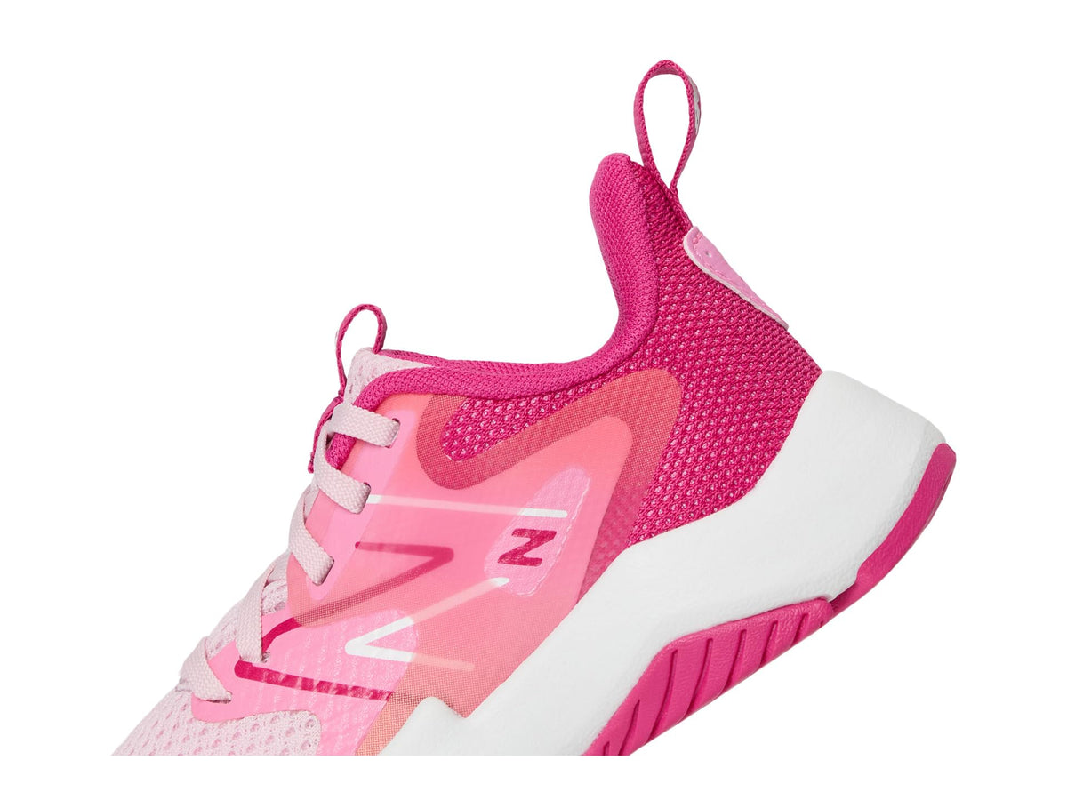 Close-up detail of New Balance girls sneaker showing mesh upper and heel pull tab