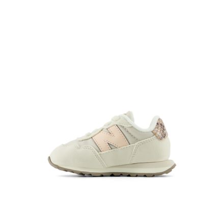 New Balance 237 infant bungee sneaker with glitter heel tab, lateral side view