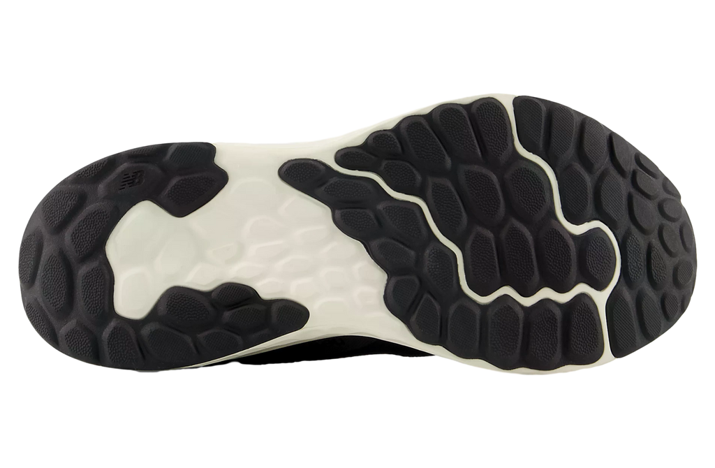 Bottom sole view of New Balance running shoe with hexagonal rubber tread pattern