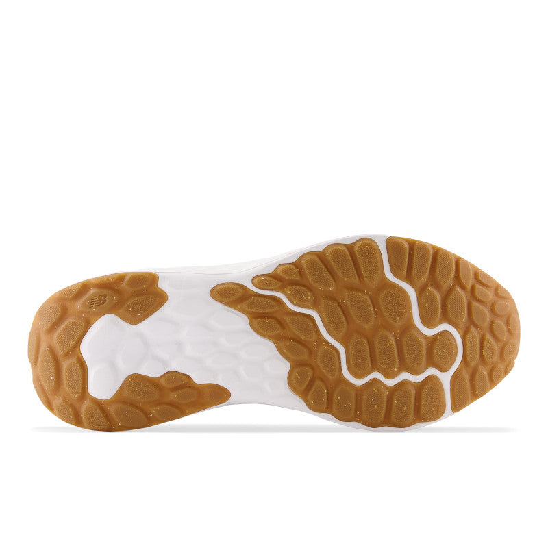 Bottom view of New Balance Arishi v4 sneaker showing gum rubber outsole tread pattern