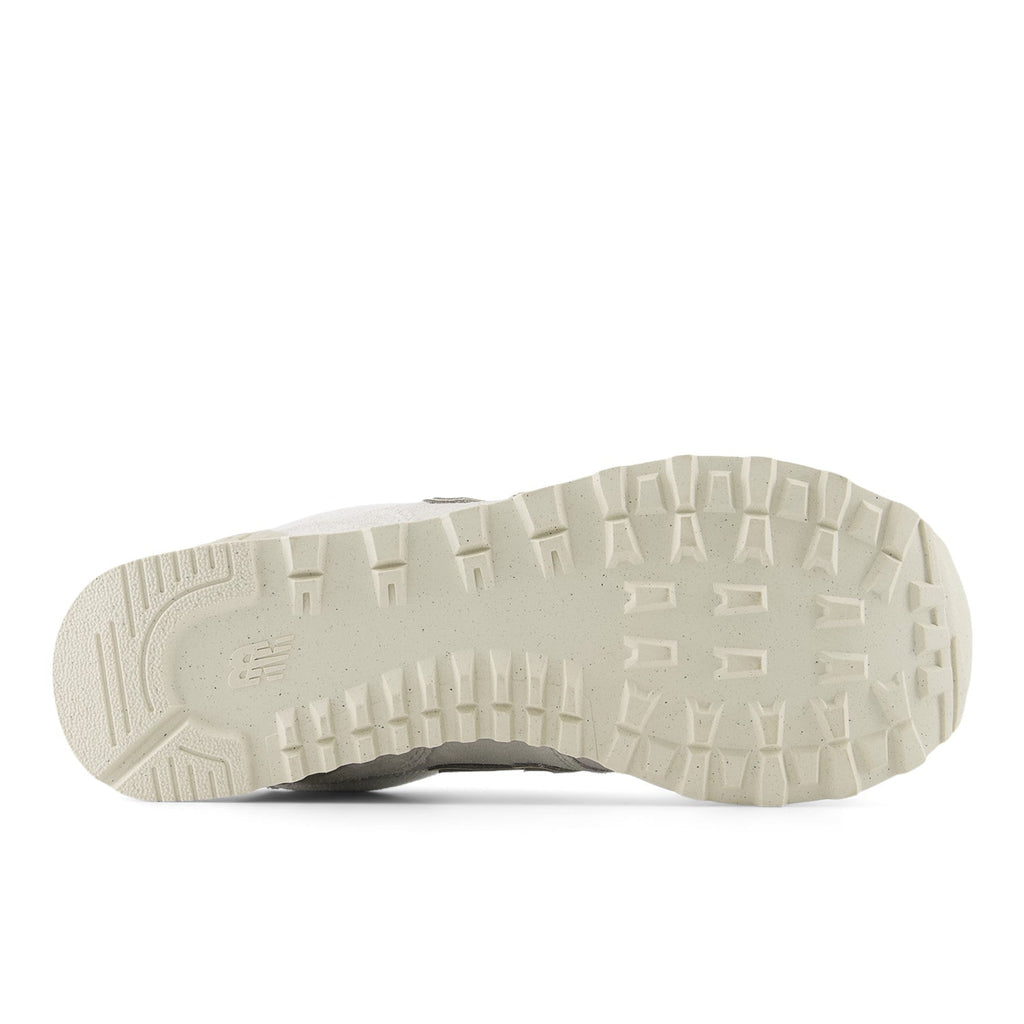 Bottom sole view of New Balance 574 sneaker showing tread pattern and rubber outsole
