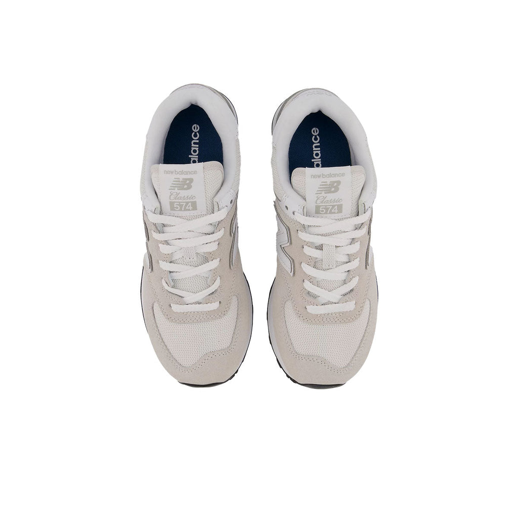 New Balance 574 Classic sneakers shown from above with white laces and blue insoles