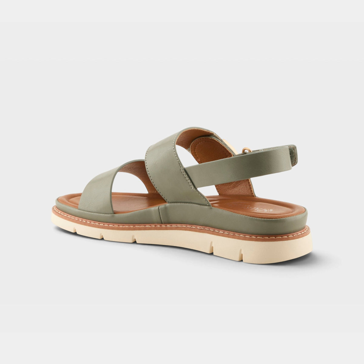 Rear view of a women's flat sandal with sage green straps and slingback ankle closure