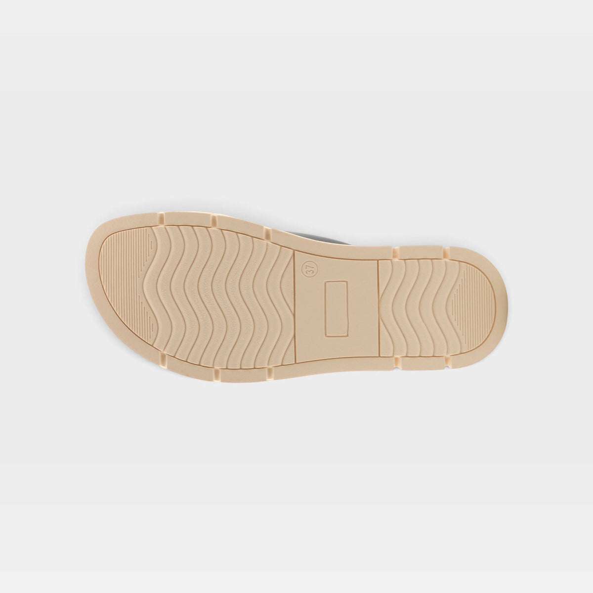 Bottom sole view of a sandal showing wavy tread pattern and segmented outsole design