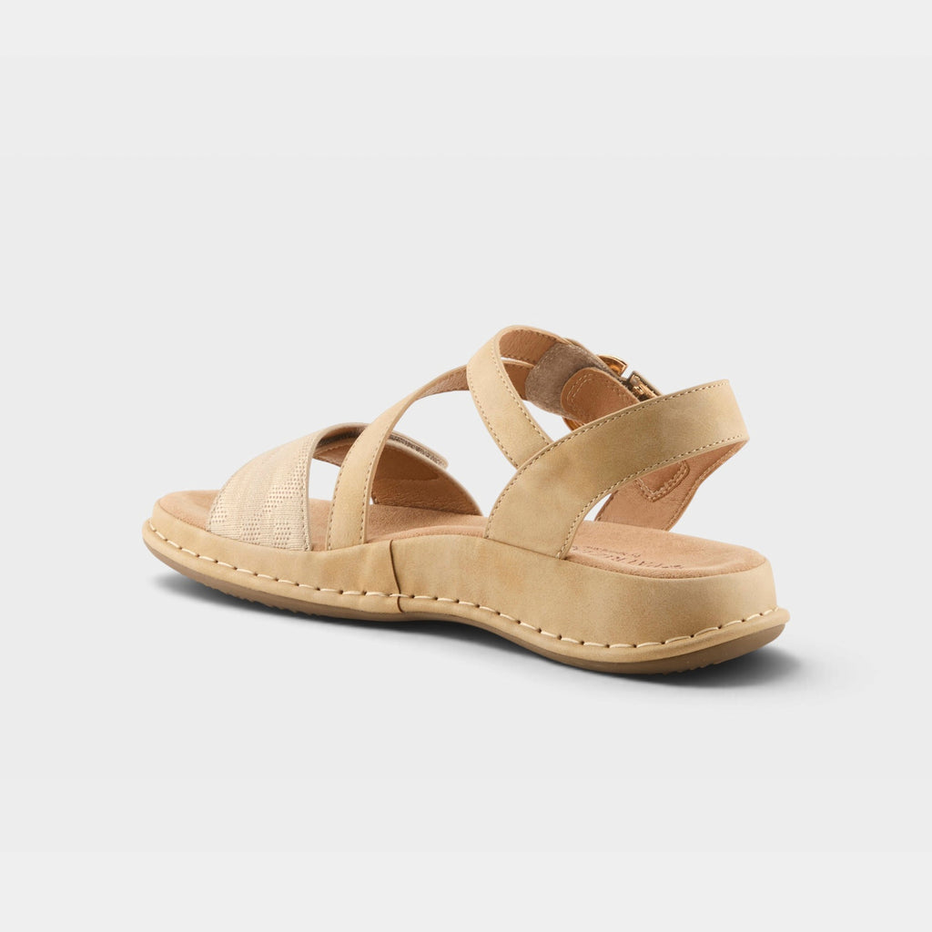 Back view of a strappy beige leather sandal with crossover straps and zipper closure