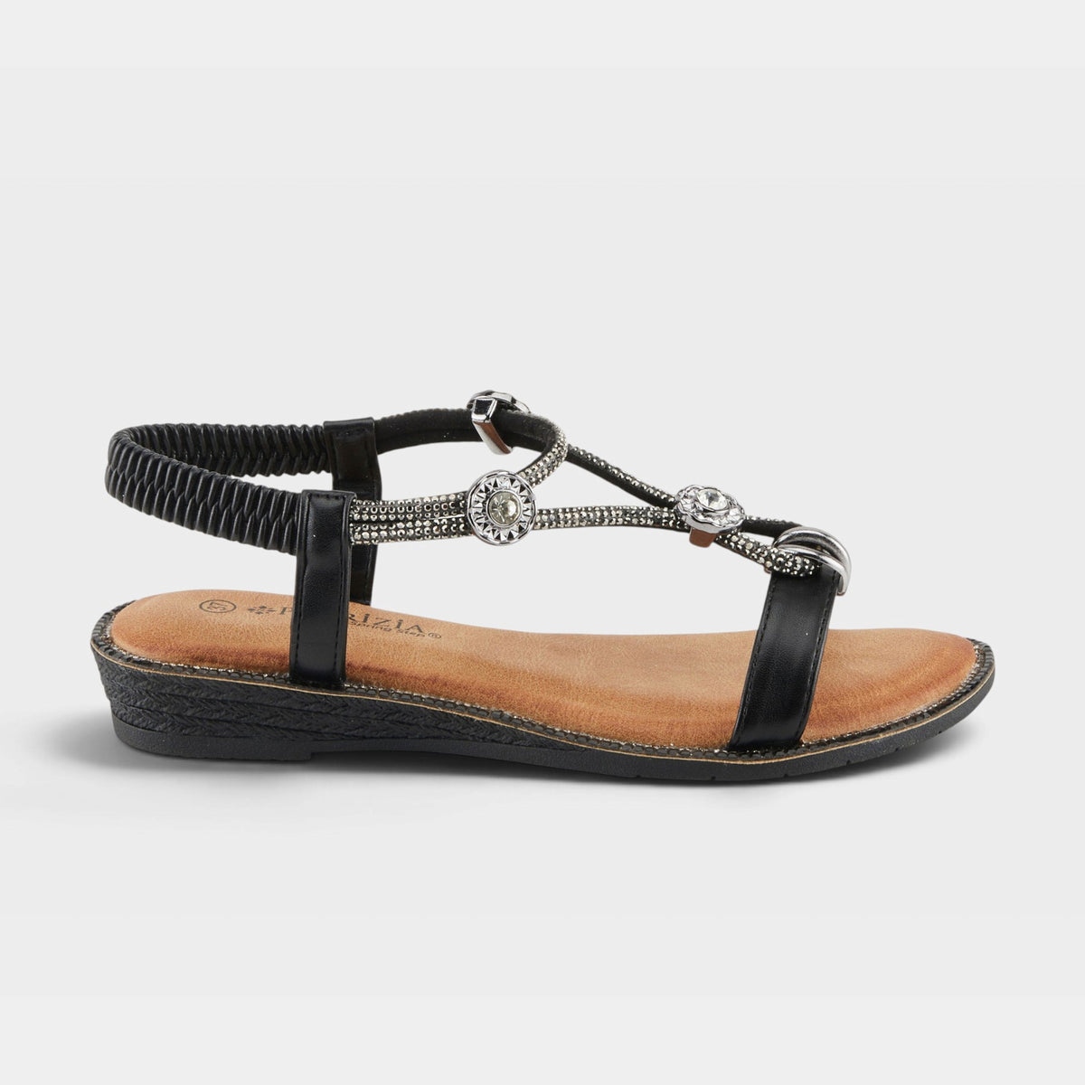 Patrizia women's flat sandal with rhinestone T-strap, silver medallion embellishments, and elastic back strap