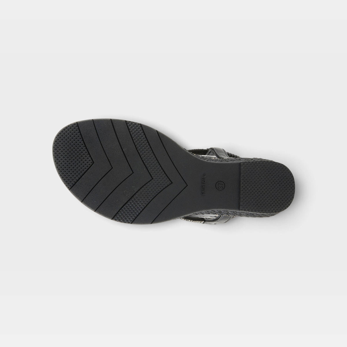 Bottom sole view of a black women's sandal showing chevron tread pattern and heel strap