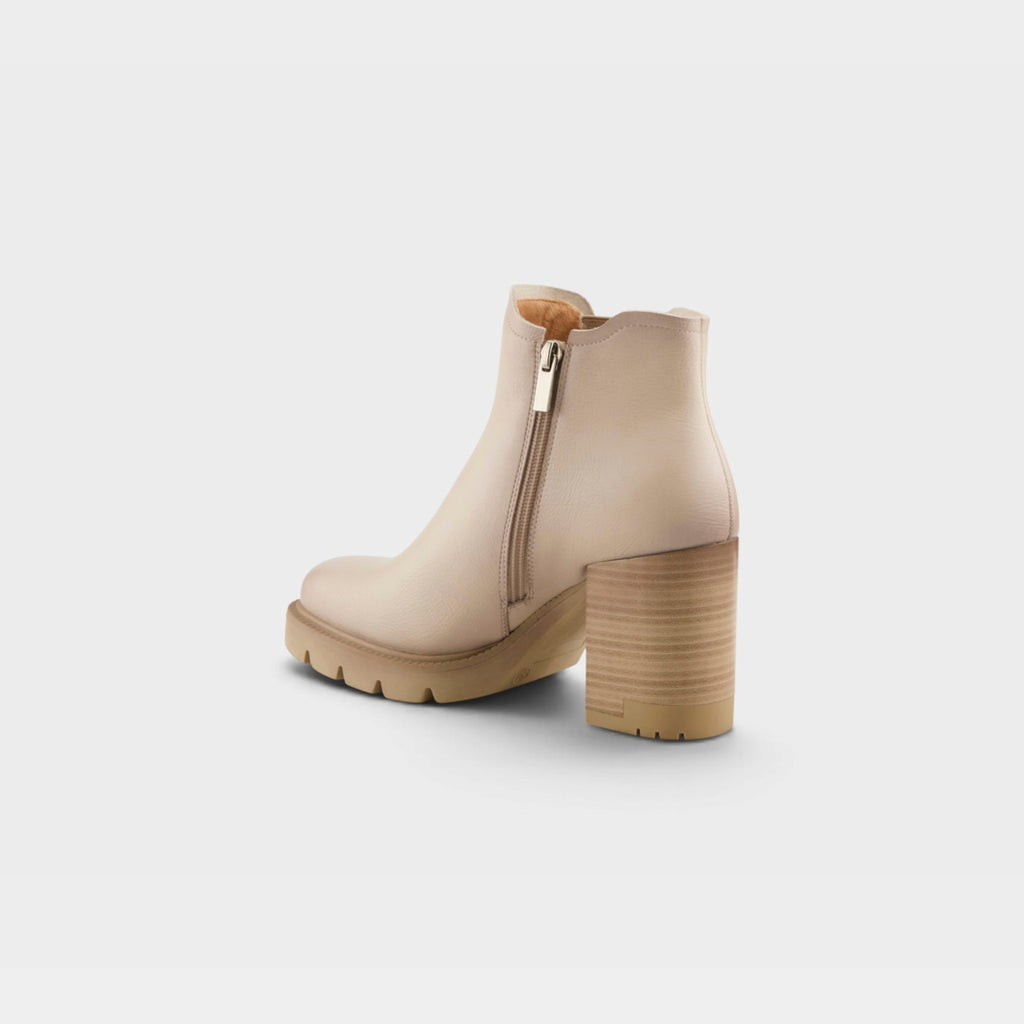 Womens ankle boot with block heel, side zipper, and lug sole, rear view