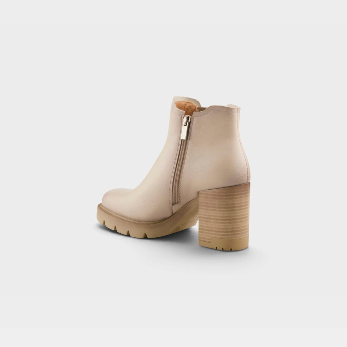 Womens ankle boot with block heel, side zipper, and lug sole, rear view