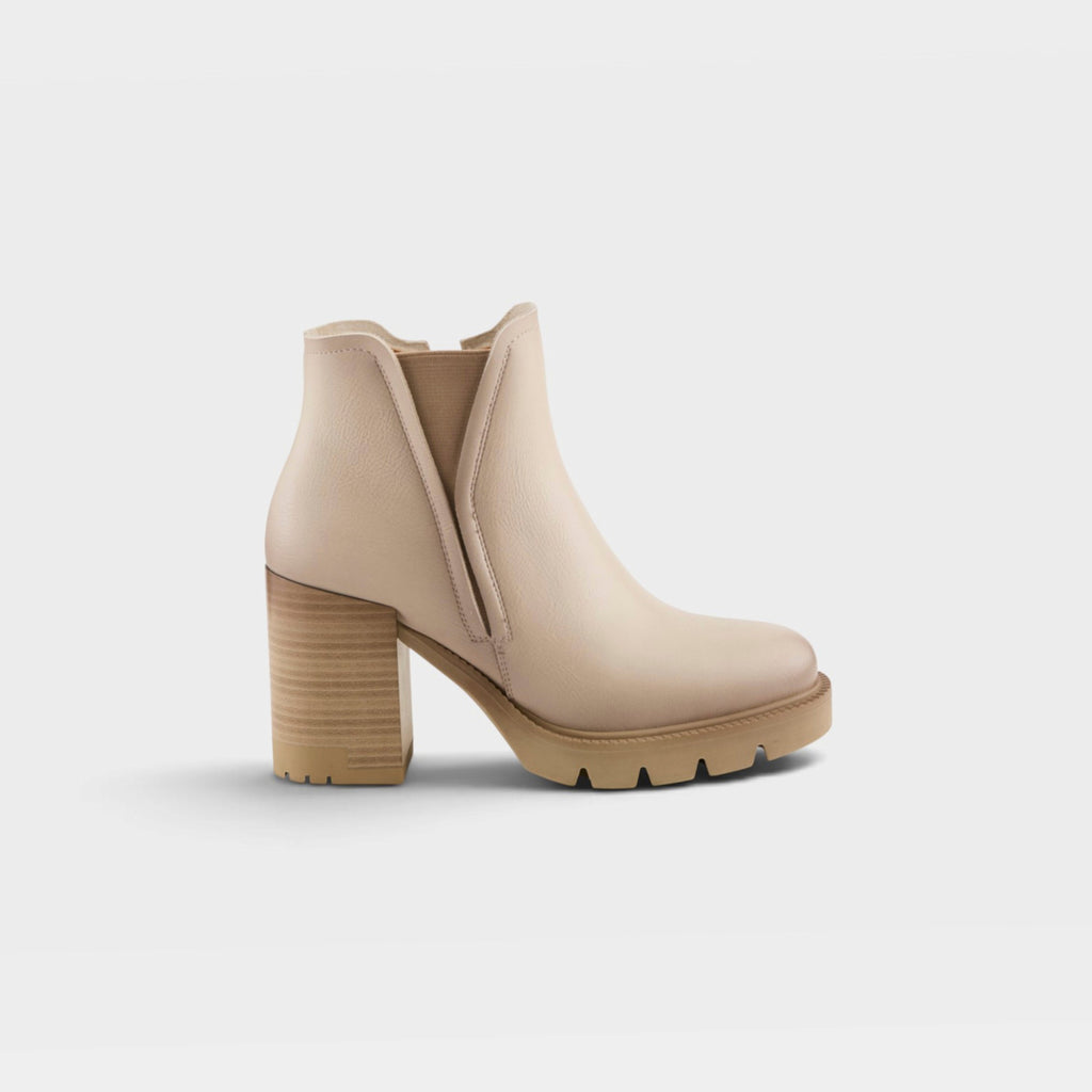 Women's heeled Chelsea ankle boot with lug sole and wooden block heel, side view