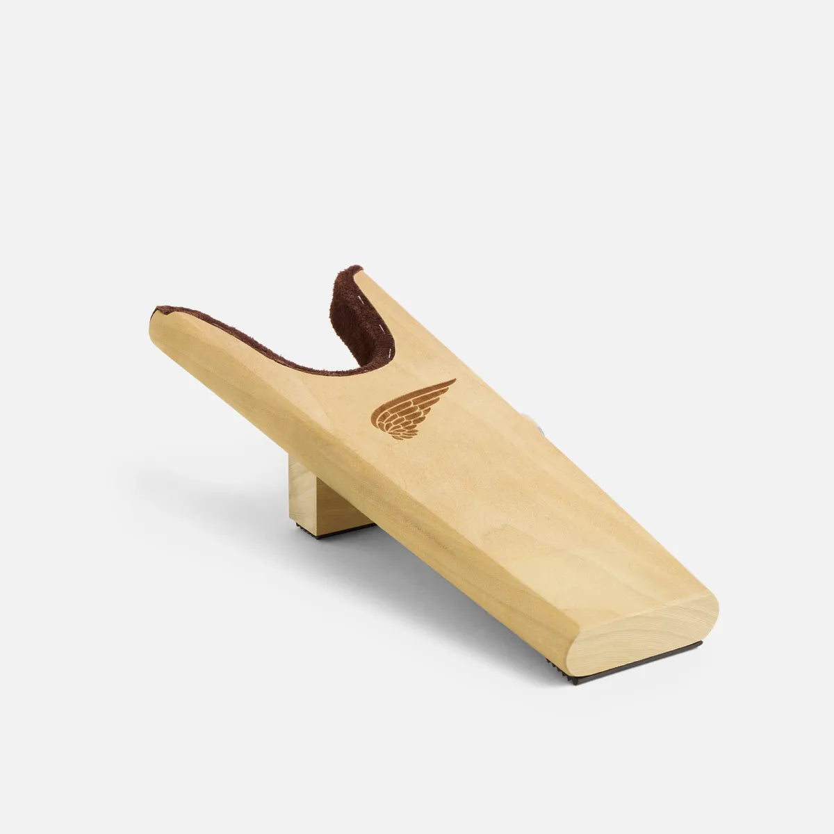 Red Wing wooden boot jack with engraved wing logo and leather heel guard