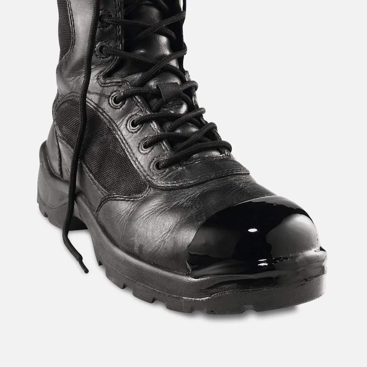 Black tactical boot with glossy toe cap, lace-up closure, and rugged lug sole