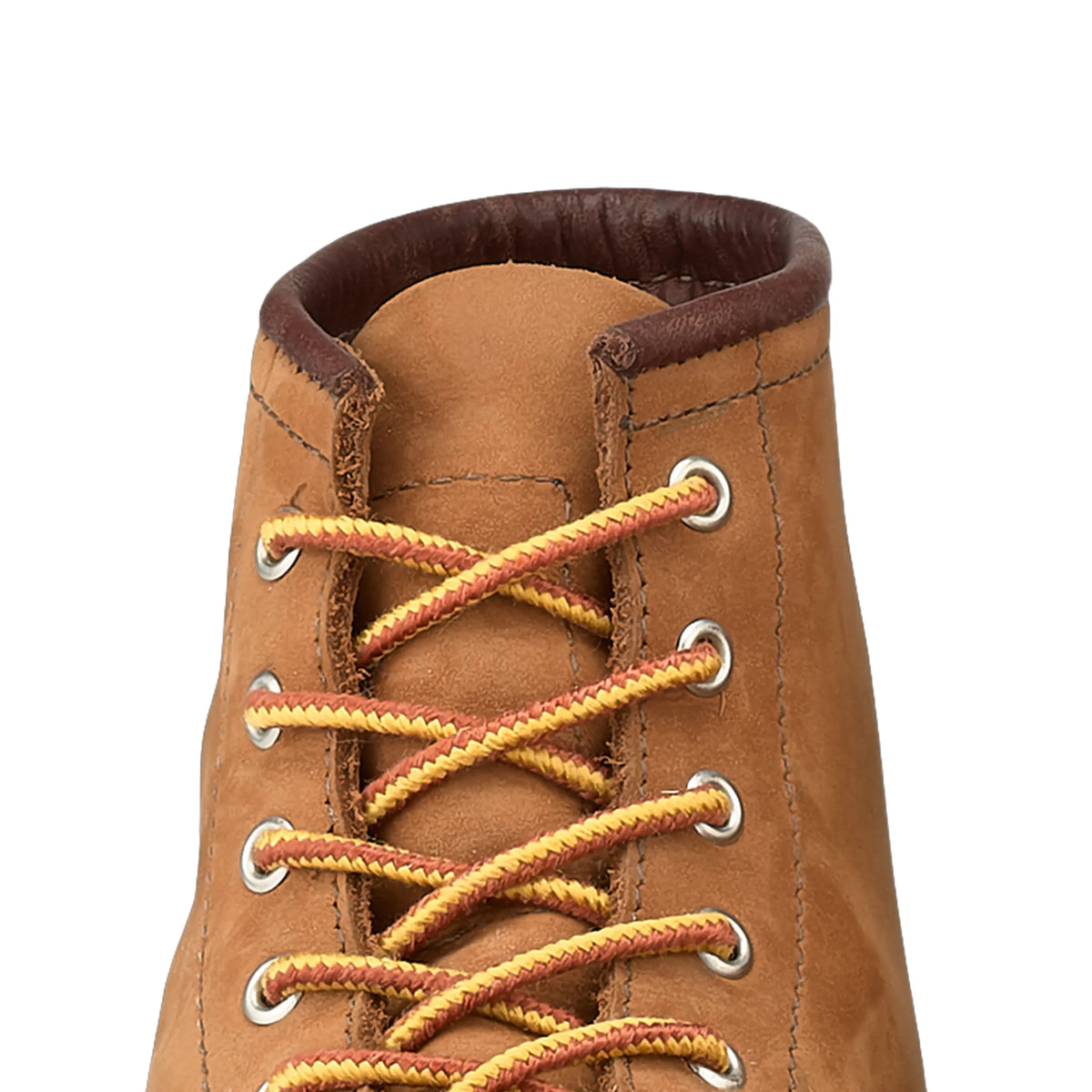 Close-up detail of Red Wing boot upper showing gold and red braided laces through silver eyelets