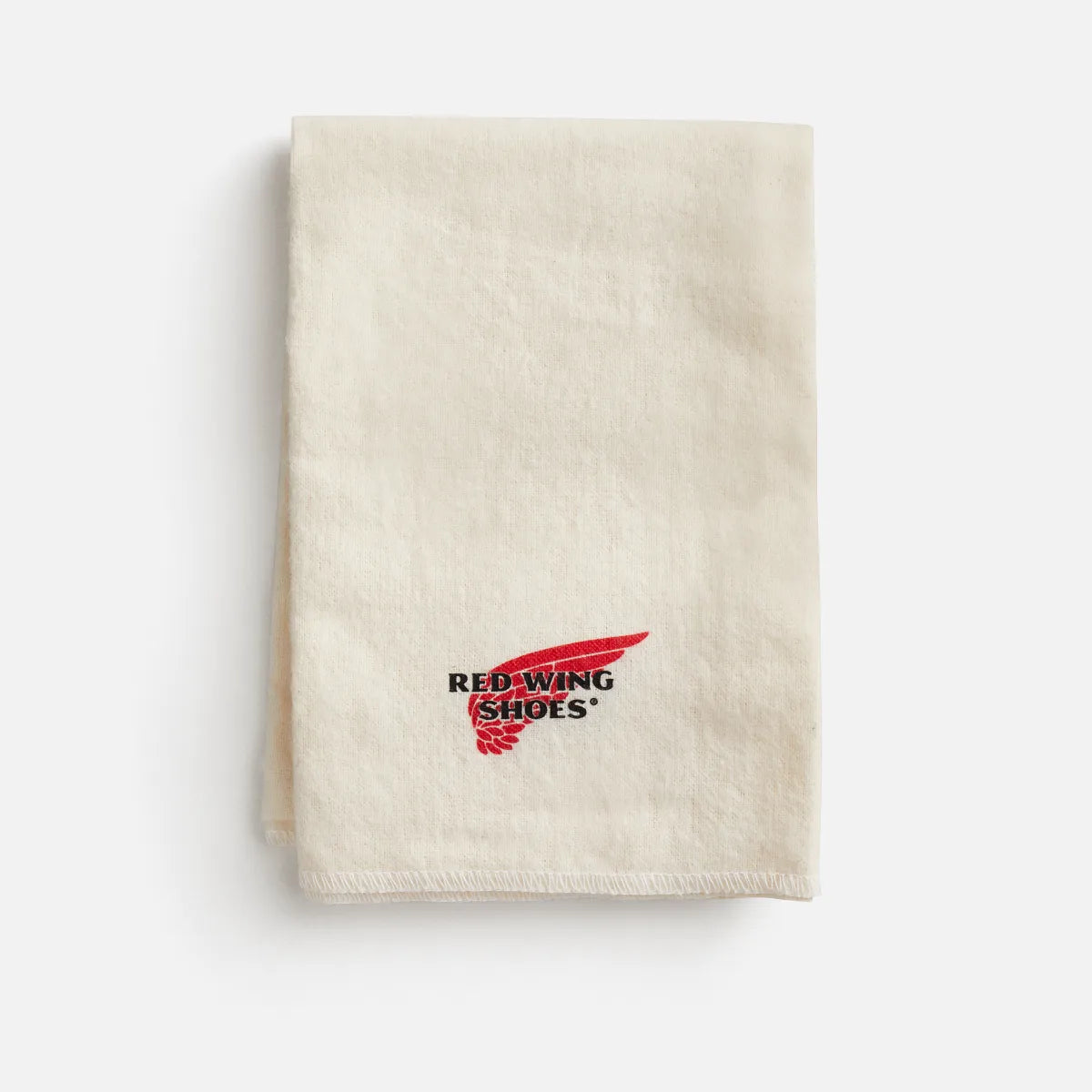 Red Wing Shoes branded cream boot care cloth folded neatly with embroidered logo
