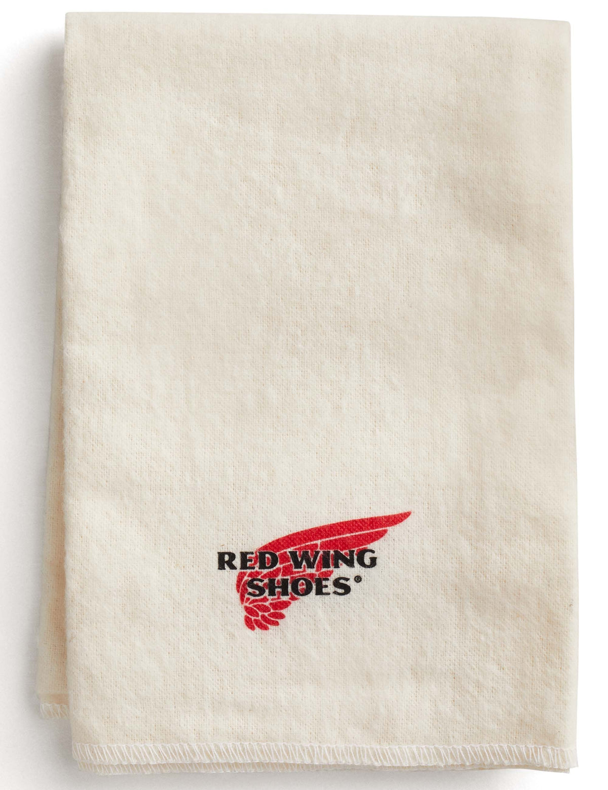 Red Wing Shoes branded cream cotton boot care cloth, folded flat showing logo