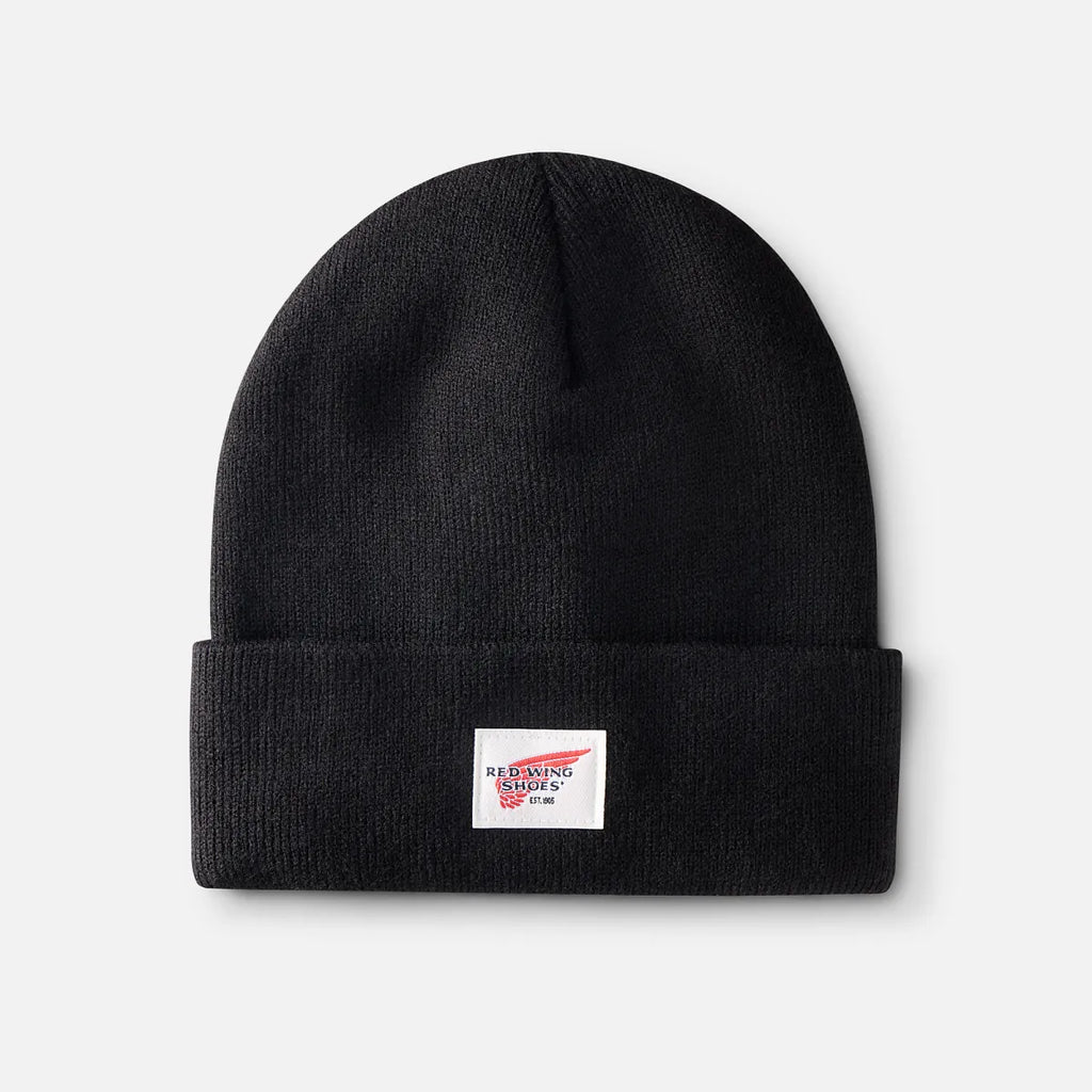 Red Wing Shoes logo knit beanie with folded cuff displayed flat on seamless background