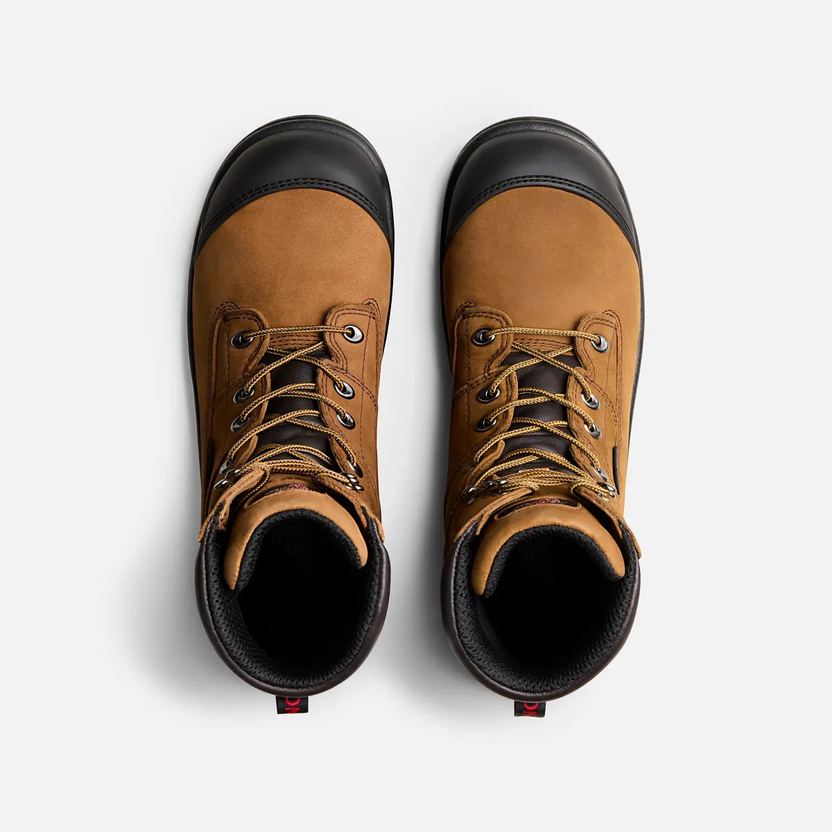 Top-down view of a pair of tan nubuck leather safety toe work boots with laces
