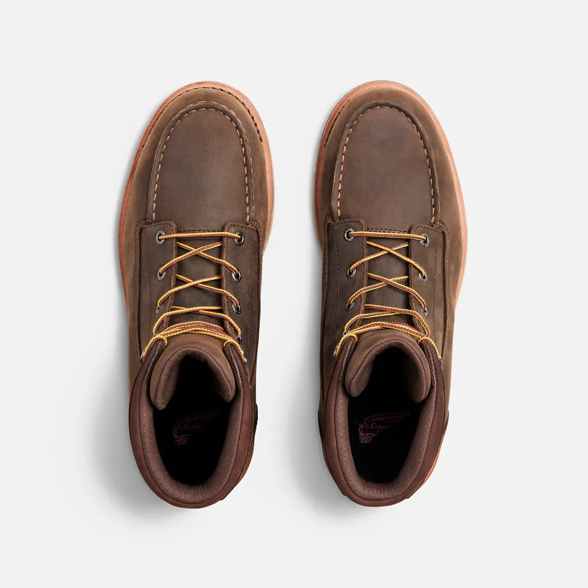 Top-down view of a pair of Red Wing moc-toe lace-up work boots with yellow laces