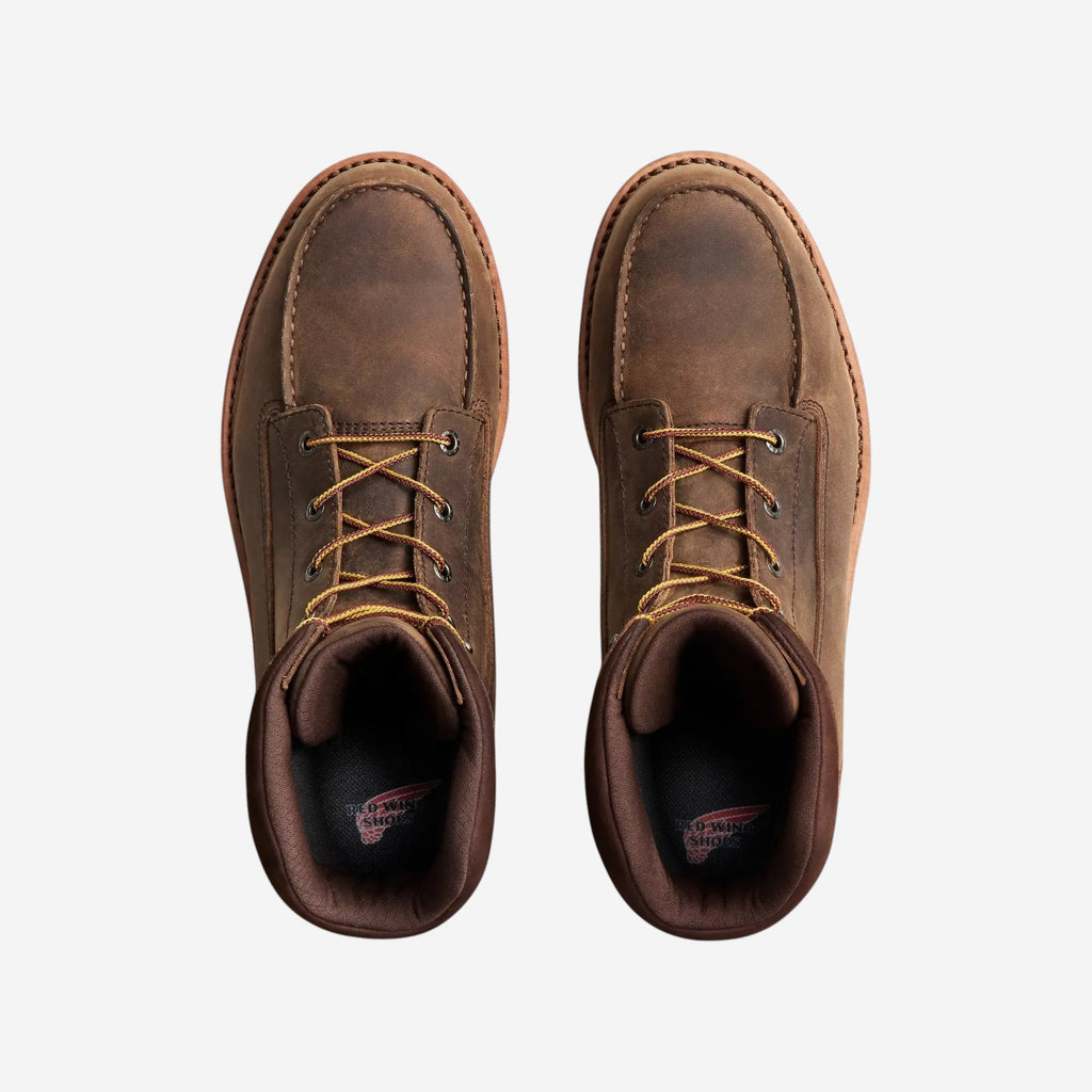 Top-down view of a pair of Red Wing lace-up leather work boots with moc toe construction