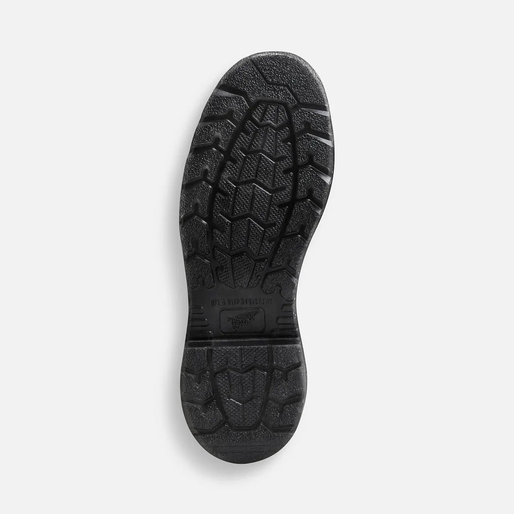 Bottom sole view of Red Wing steel toe work boot showing aggressive tread pattern