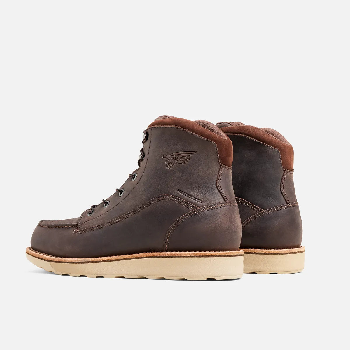 Red Wing mens lace-up leather work boots with moc toe and cream wedge sole, rear view