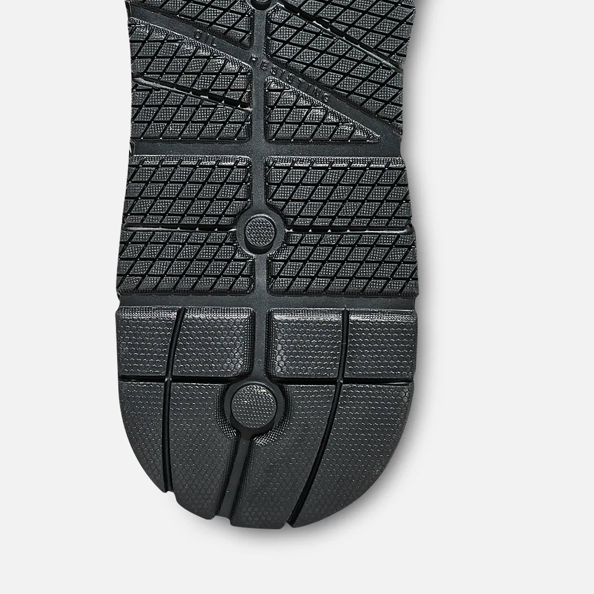 Bottom sole view of mens oxford work shoe showing textured rubber tread pattern and flex grooves
