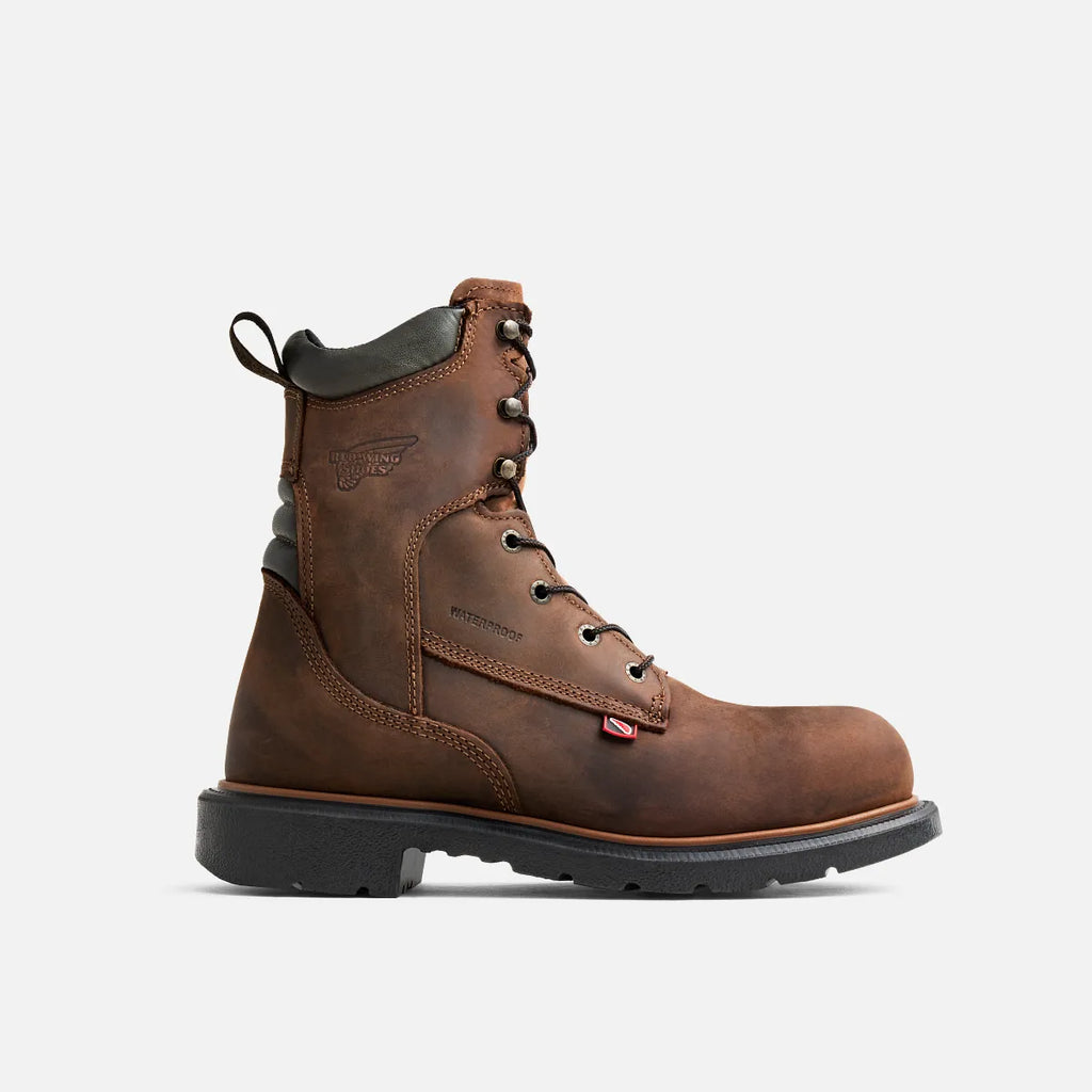 Red Wing mens steel toe waterproof lace-up work boot with thick rubber outsole, side profile view