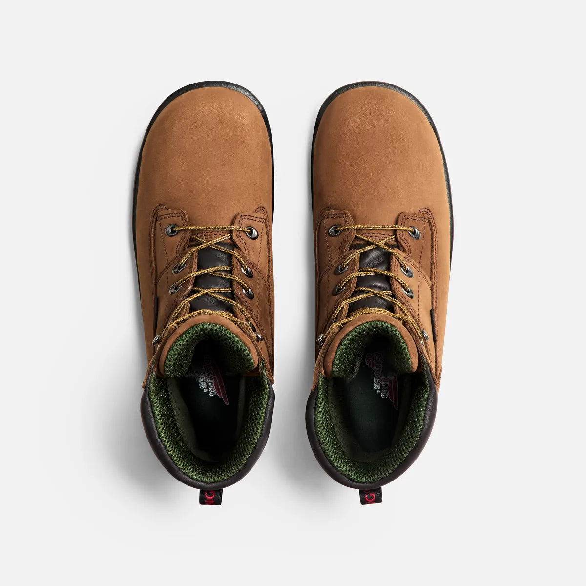 Top-down view of a pair of brown nubuck leather lace-up safety work boots with green collar lining