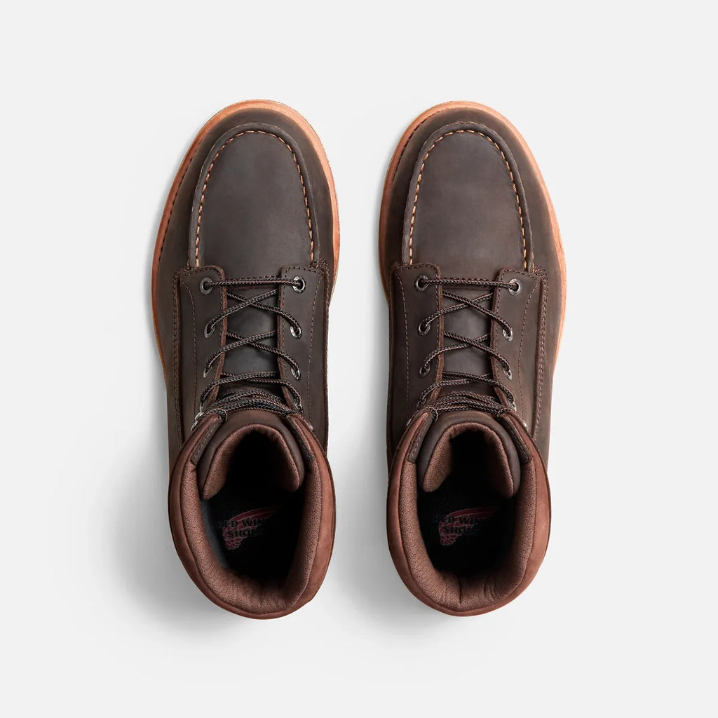 Top-down view of a pair of Red Wing lace-up moc-toe leather work boots with gum sole