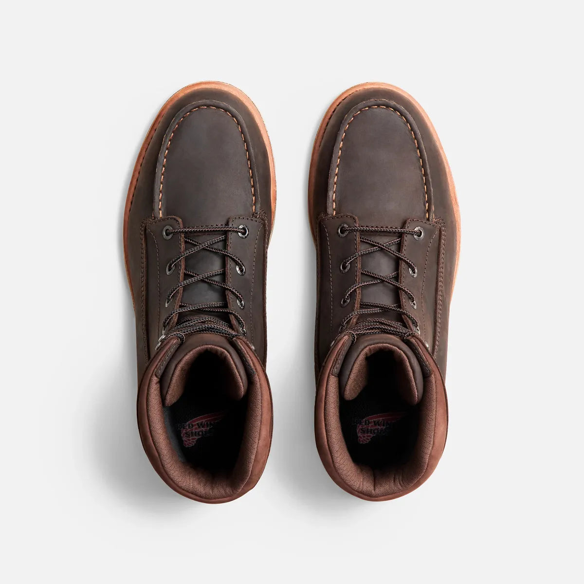 Top-down view of a pair of Red Wing lace-up moc-toe leather work boots with gum sole