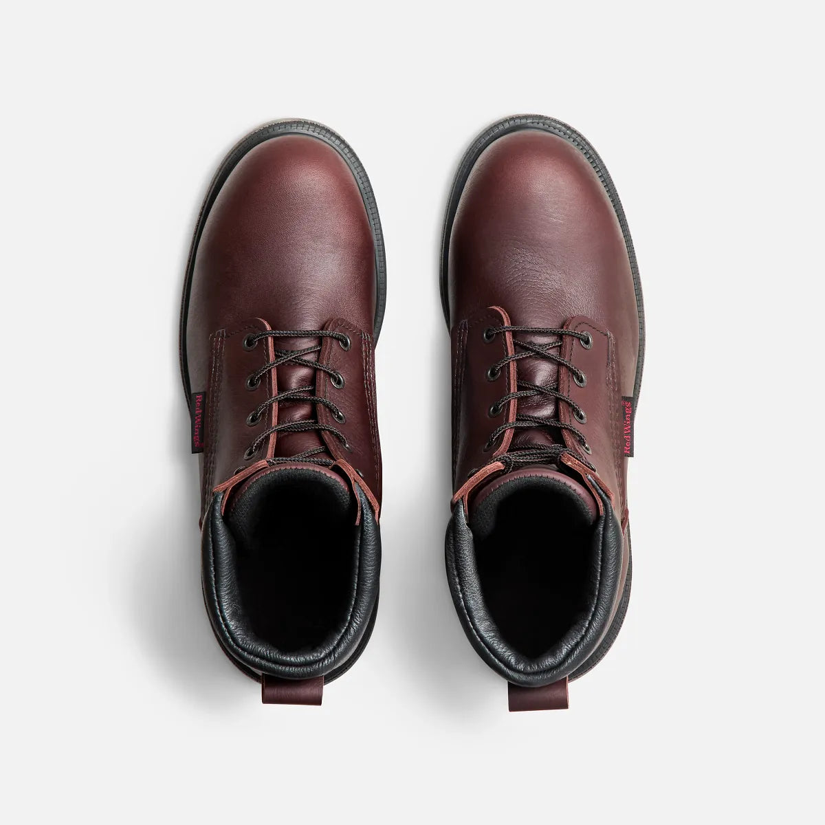 Red Wing mens steel toe work boots shown from overhead on white background, pair displayed